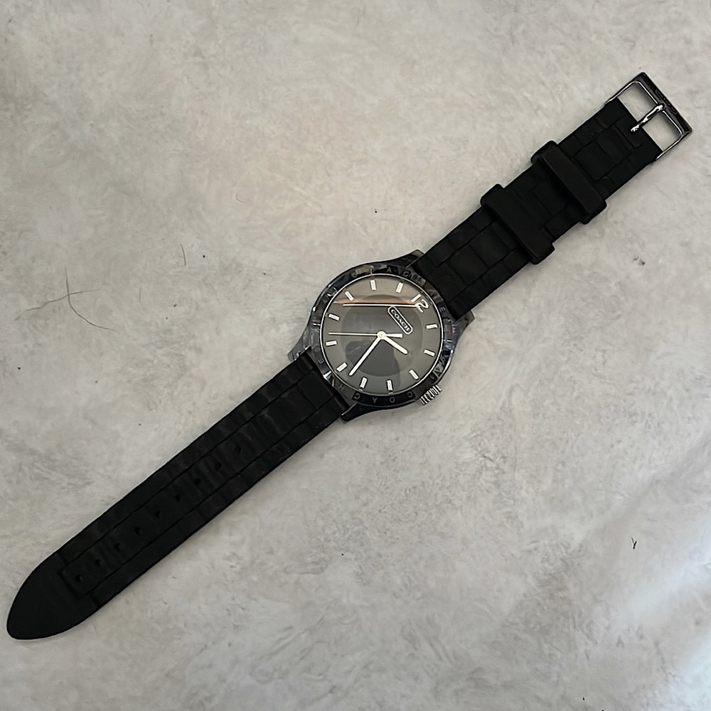 NEEDS BATTERY! Coach watch w/ black rubber band and silver accents. No scratches
